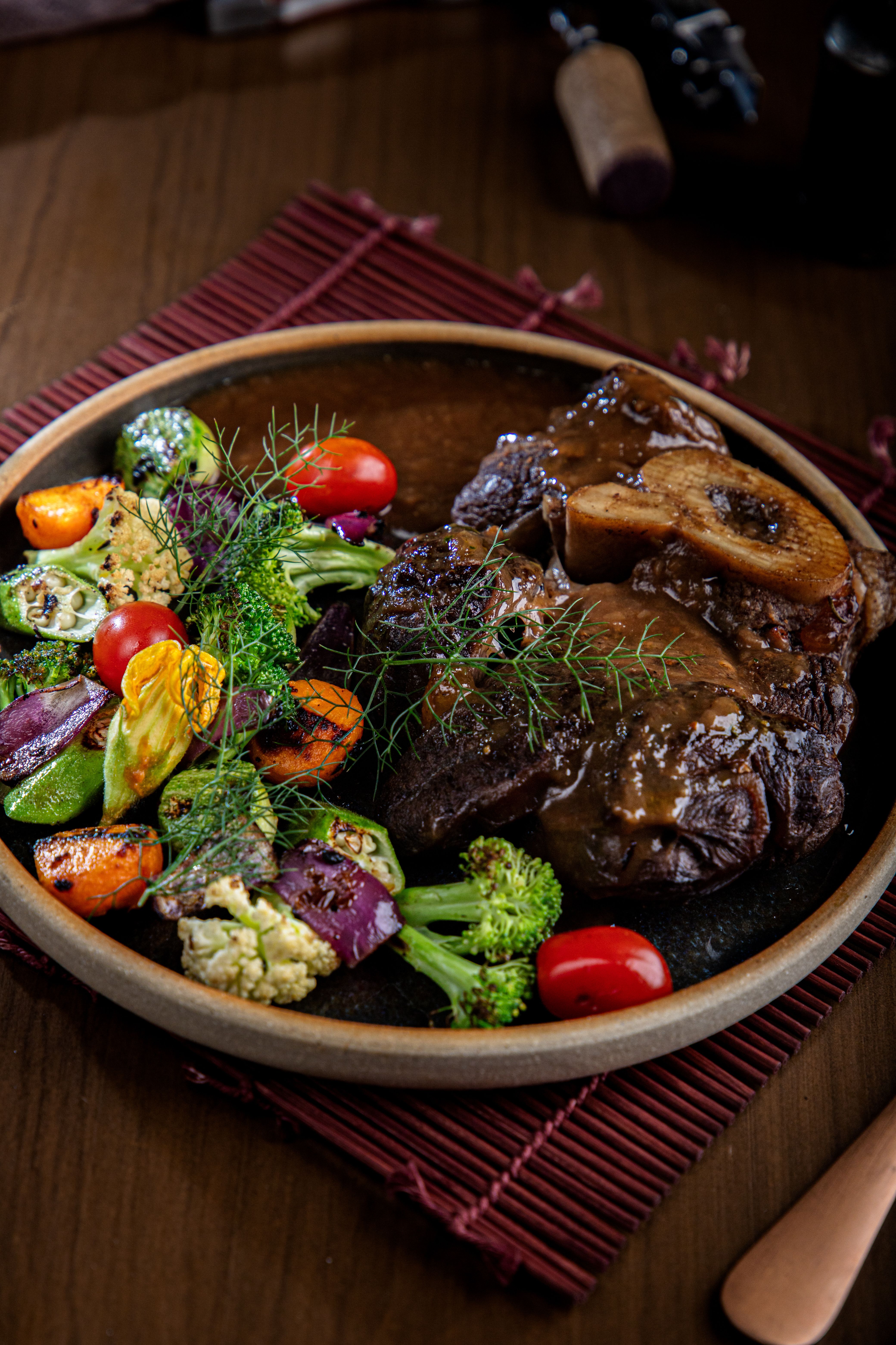 Braised short rib with roasted vegetables for coastal catering in Galveston