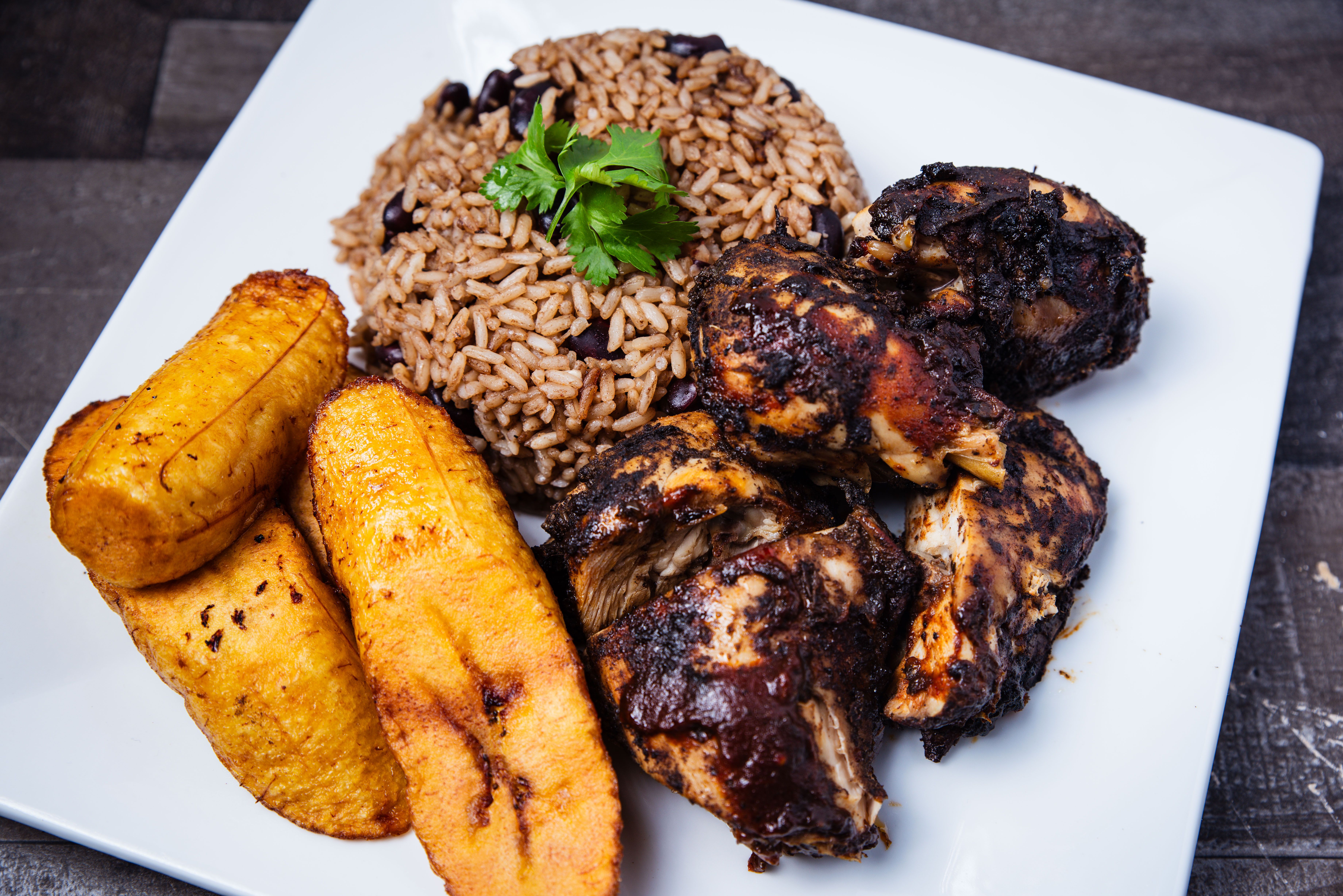 Jerk chicken with rice and peas and fried plantains for coastal catering in Galveston