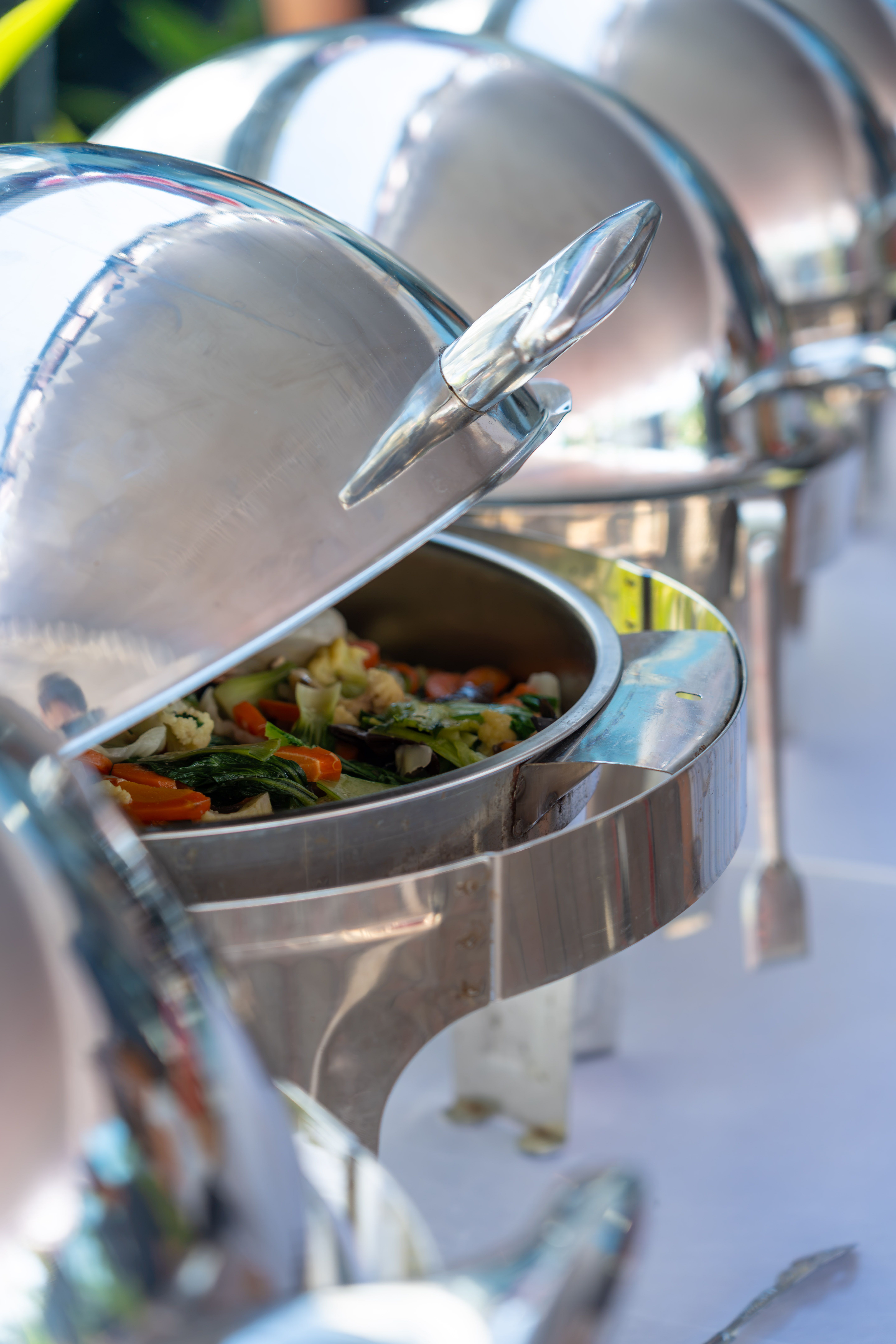 Stainless chafing dishes on a catering buffet in Houston
